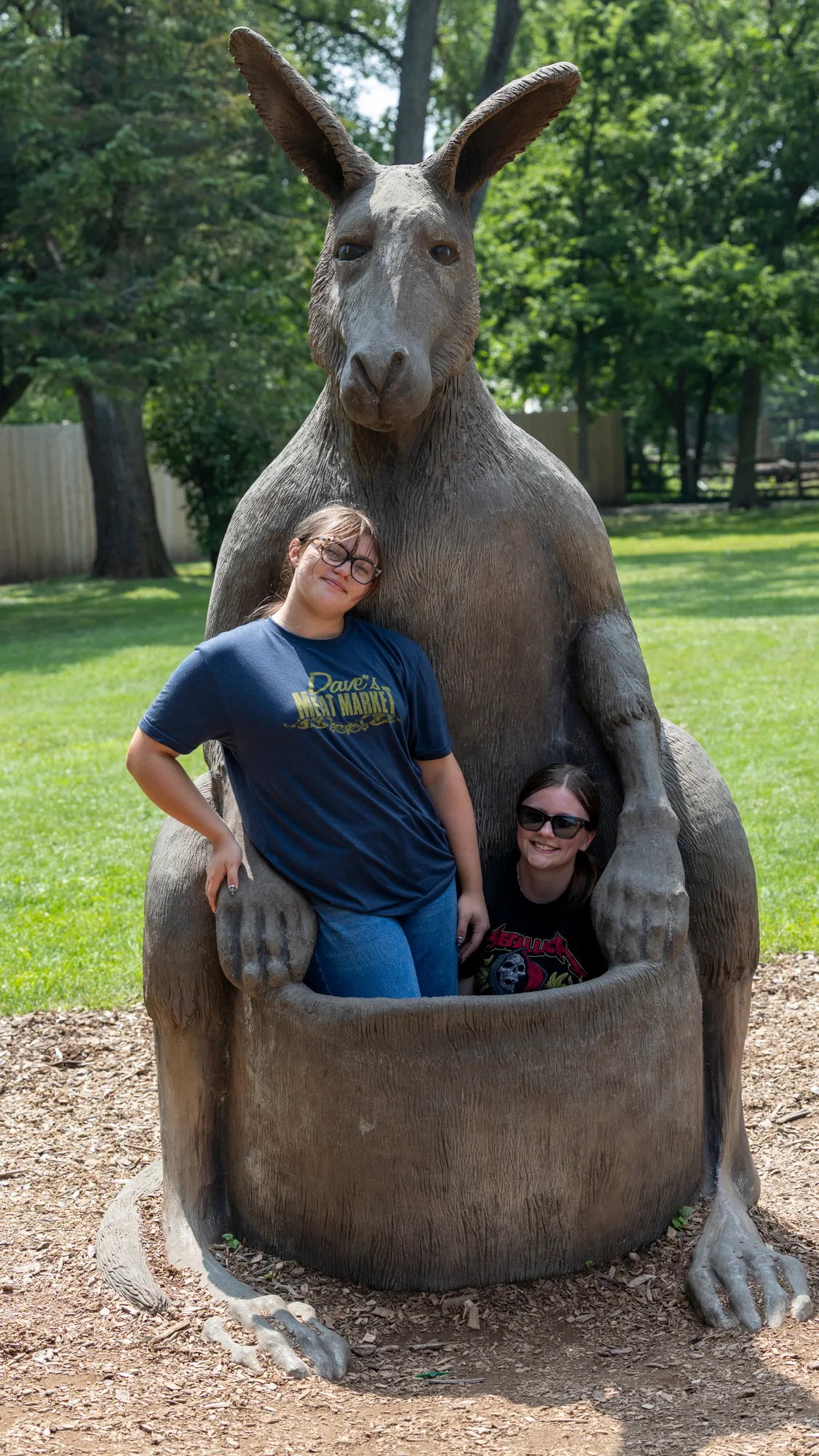 megan and caitlin in the pouch of the kangaroo statue